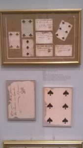 They sometimes used playing cards as currency. These have notes on the back indicating they're good for two loaves of bread--about 12 1/2 cents.