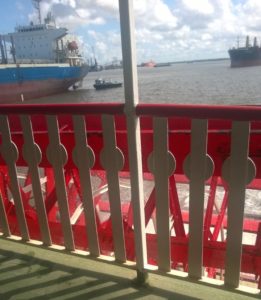 The paddle wheel of the steamboat.